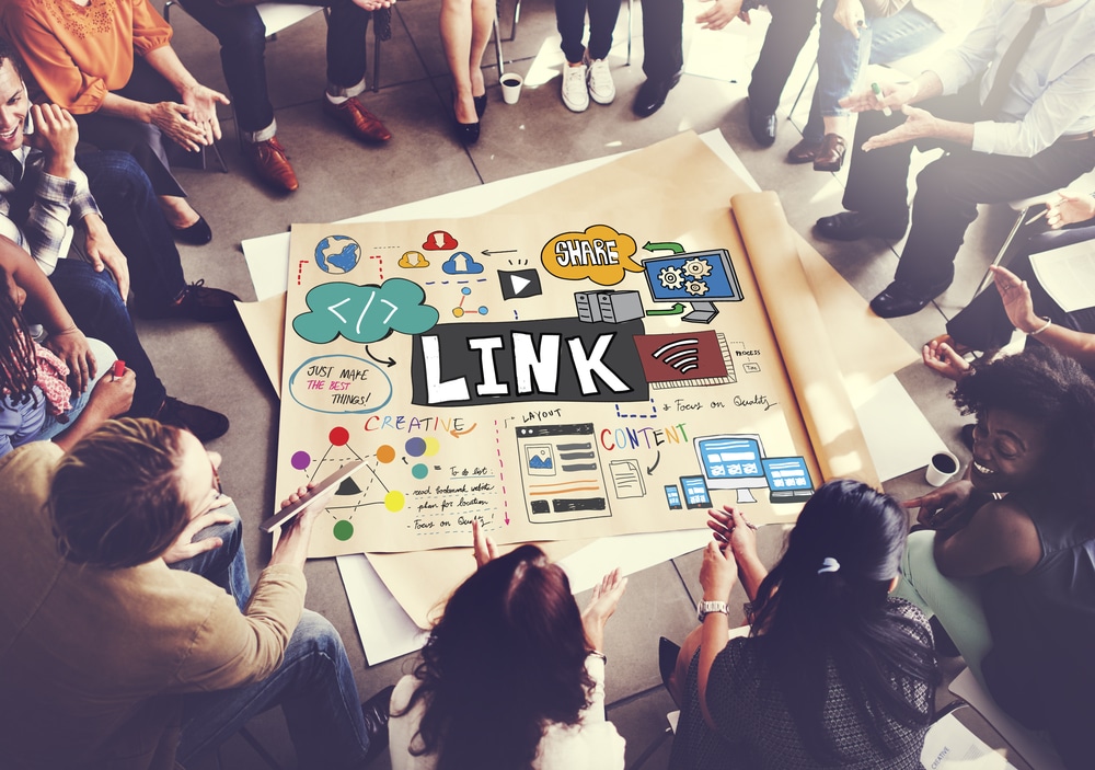 people gathered around a link diagram