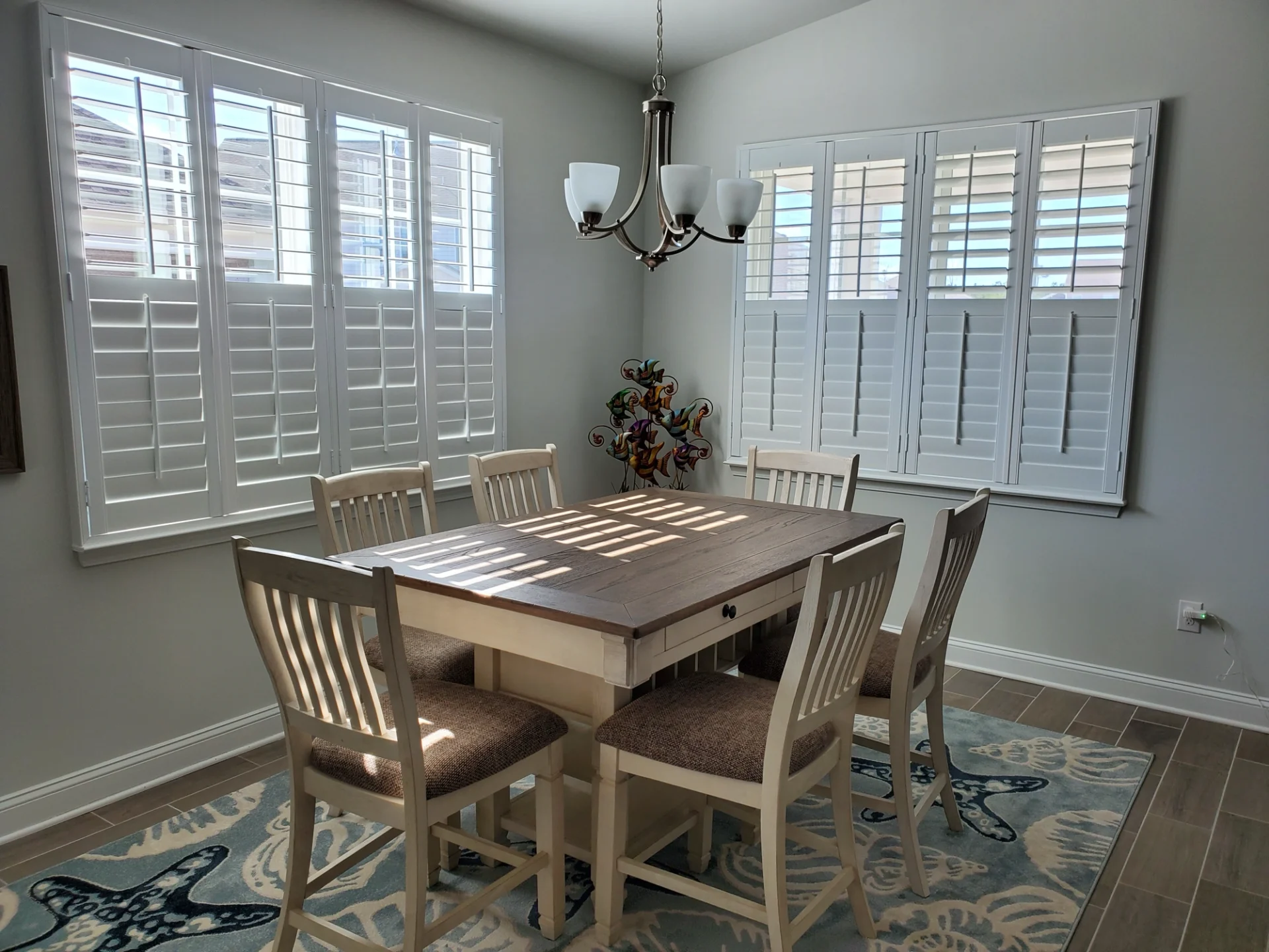 Plantation shutters on windows in dining nook
